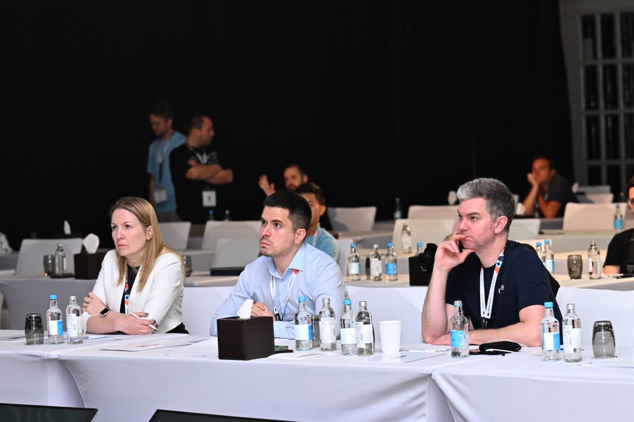 Stanko Nedić seated with fellow judges during a formal review session